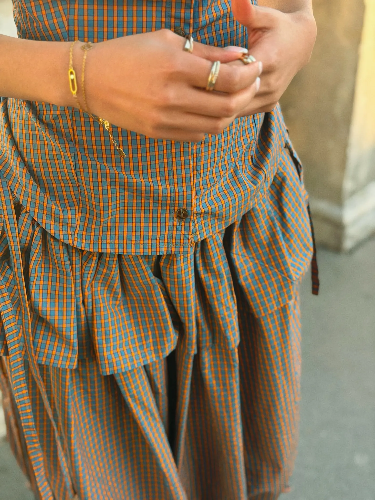 Detail shot of Shytrovert handmade corset shirt with functional pockets in deadstock plaid fabric.